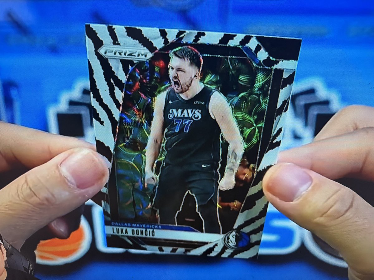 Hit man rips got this Tiger Stripe Luka Doncic card in this rare from this  China Prizm box Sick card @HitmanRips