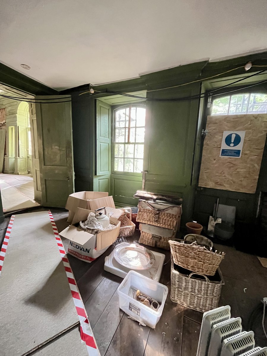 Salvaged bits and pieces, awaiting storage — plus safe routes for travelling across some very rotten floor boards.