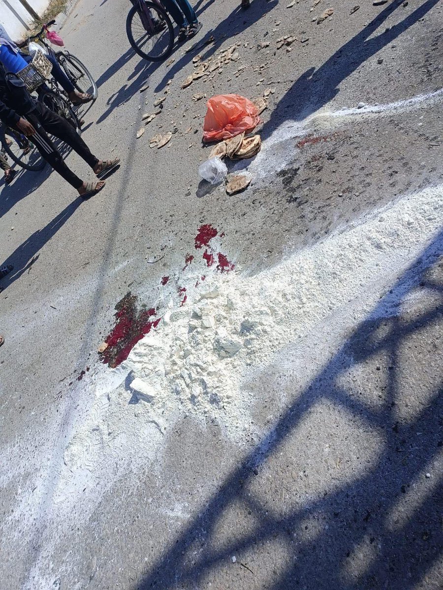 A simple bicycle, carrying a bag of flour and a hope for life, was their way to their place of displacement... But the shell beat them to it, so the flour mixed with blood, and the morsel was lost before it arrived.