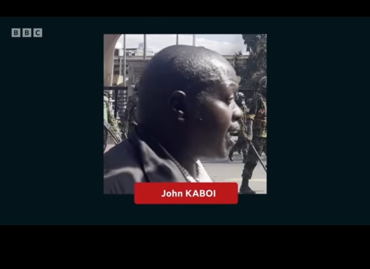 wayne_gakuo's tweet image. As revealed in the BBC documentary, Police officer John Kaboi was shouting "shoot to kill orders" to other officers outside Parliament. One of the police officers (2nd frame) shot two (could be more) unarmed Kenyans, and they died on the spot.
#BloodParliament #RutoMustGo