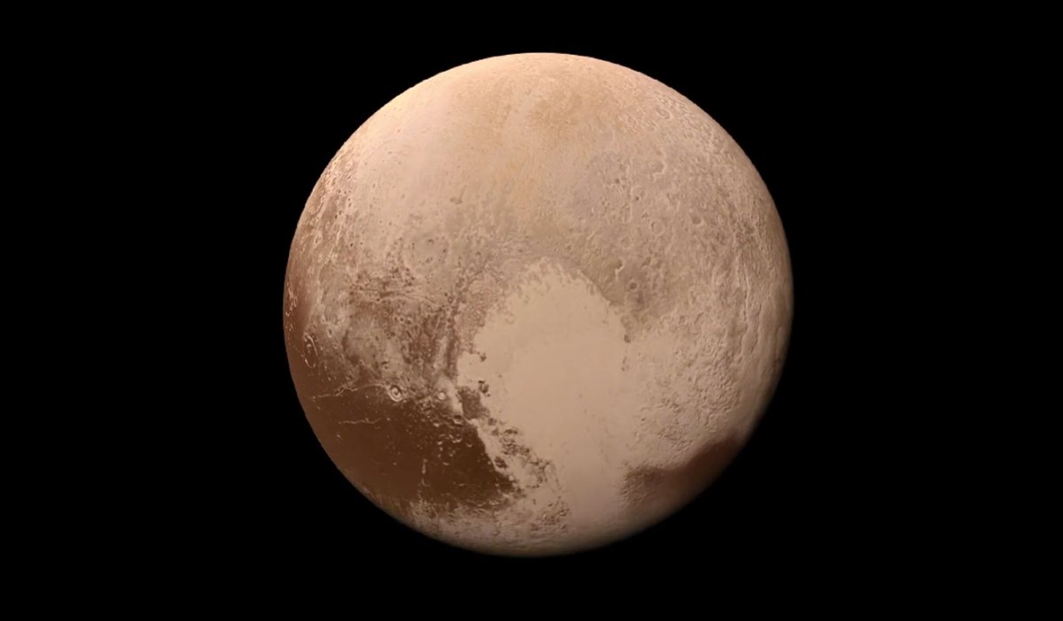 This image was created from over 100 images taken by NASA’s New Horizons spacecraft during its 2015 approach and flyby of Pluto. It shows a simulated descent from a distant view of Pluto and Charon down to the shoreline of Sputnik Planitia. Scientists interpolated black-and-white frames and added low-resolution color from New Horizons’ Ralph instrument to create the video. After a 9.5-year journey covering over 3 billion miles, New Horizons passed within 7,800 miles of Pluto, capturing detailed images of Pluto and its moons. (Credit: NASA/JHUAPL/SWRI)