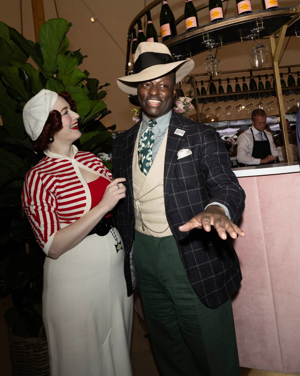 goodwoodrevival's tweet photo. An appreciation post for Dandy Wellington's 2024 #GoodwoodRevival outfits. Our sharp-dressed Revival Ambassador combines colourful suits with refined accessories, taking to the #RevivalStyle Stage to interview our esteemed guests and #BestDressed contestants. Which of Dandy's outfits inspires your style the most?