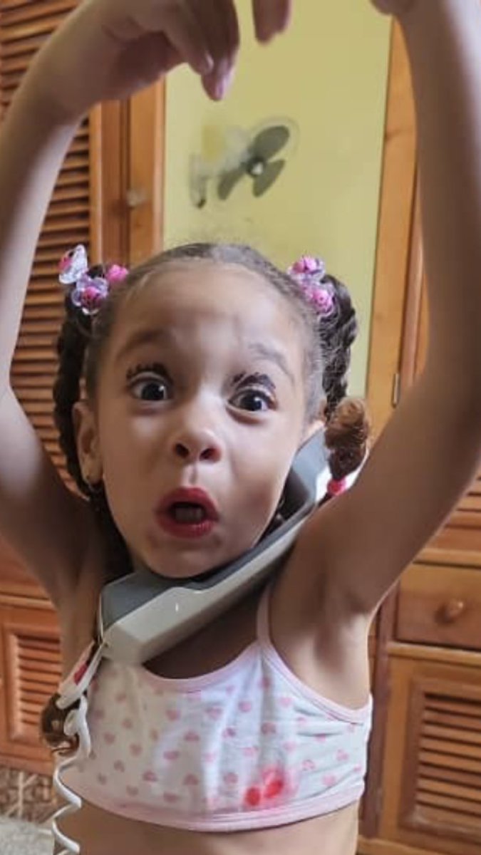 My little cutie practicing her makeup skills.