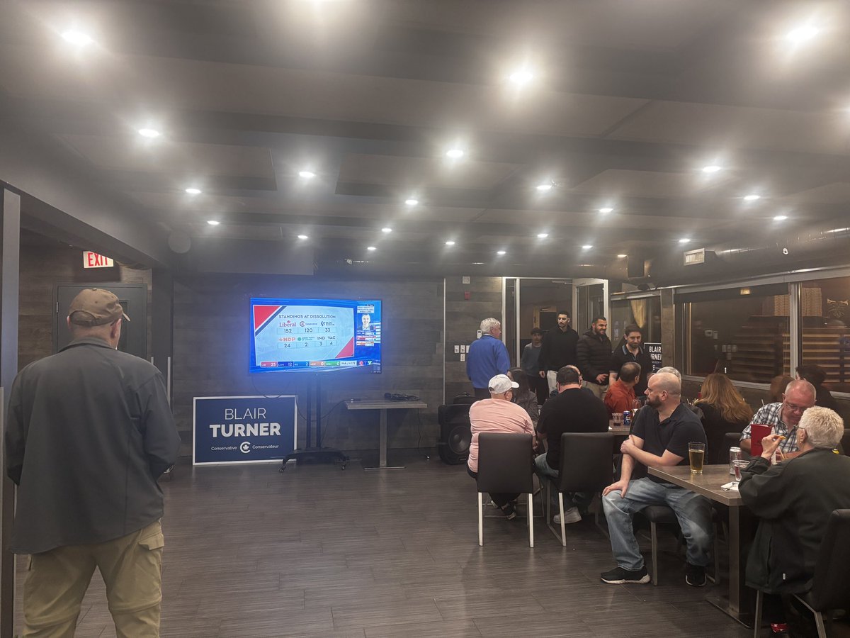 As polls in Ottawa close, Blair Turner’s campaign party falls quiet as attendees turn to face the television. #CanadaElection2025