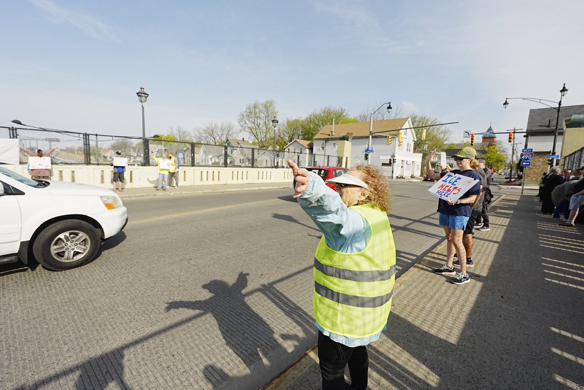 tyee23's tweet image. Protesters lined both sides of the Ames Street bridge over I-490