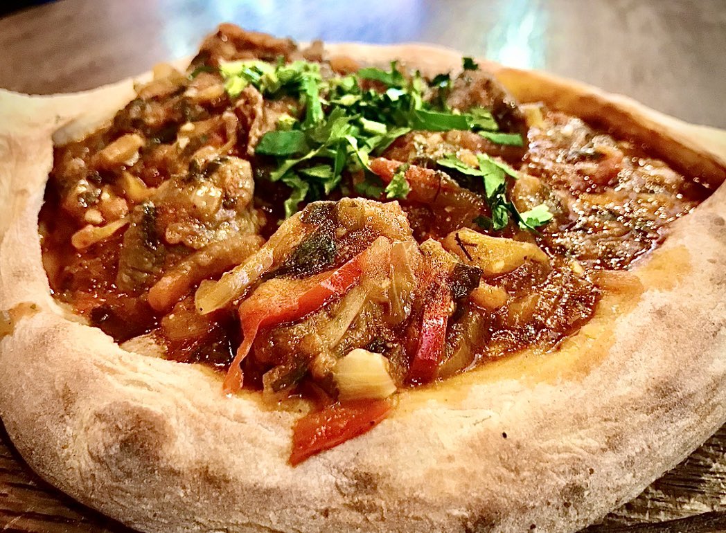 At Tiflisi in The Beach, the Khachapuri Kalakuri is comfort food with character. Georgian flatbread stuffed w/ stew, then baked until golden &amp; blistered. Perfect for tearing and sharing. More than just a snack, it’s a bite-sized passport to the Caucasus 🇬🇪