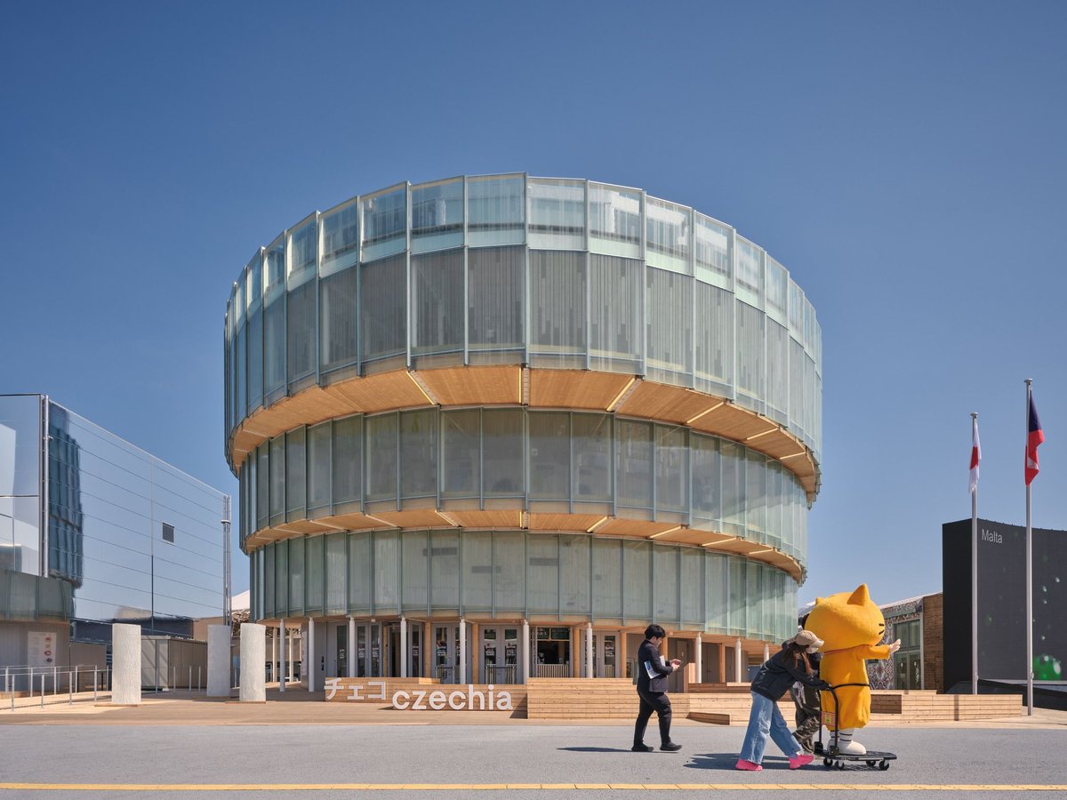 designboom's tweet photo. translucent glass facade outlines czech pavilion's spiral form at expo 2025 osaka https://t.co/6e00EqVaVX https://t.co/wc1tBZIdAs