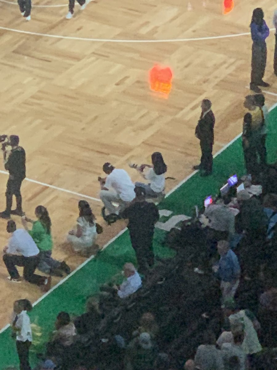 At halftime of game five of Celtics-Magic, Boston based R&amp;B singer Yanna G. 

Managed by Bryant men’s basketball alum Ikenna Ndugba (black sweatshirt, Words Speak Life records). 

Brown men’s basketball player Aaron Cooley (white T-shirt, BIO productions) filming the performance