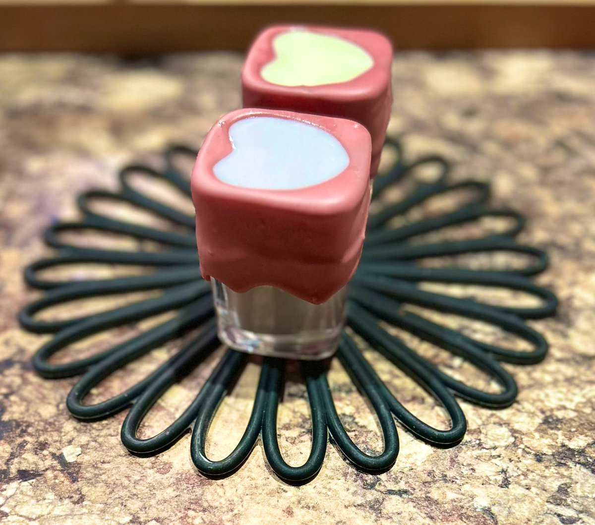 #Namorweek day 6:
“Let us burn it together”
A coconut Taro &amp; a white chocolate cream melon double shot in heart shaped shot glasses dipped in Ruby chocolate (red color &amp; berry flavor occurs naturally in the chocolate). Inspired by Shuri &amp; Namor #Nashuri #seaprincess
<a href="/NamorWeek/">NAMOR WEEK</a>