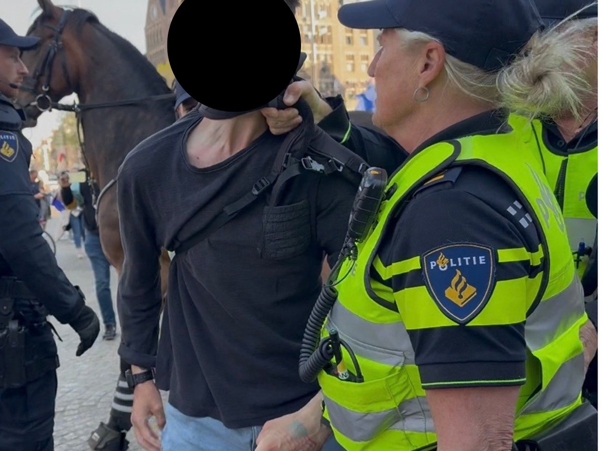 _WMedia_'s tweet photo. What are a Maccabi Tel Aviv supporter, a right-wing patriot (photo: with tattoo on his hand), and a follower of the terrorist group Kach (photo Left Laser) doing at Dam Square in Amsterdam, involving themselves in a scuffle where the police are taking control? The Maccabi Tel Aviv guy attempts to punch a pro-Palestinian demonstrator.

Manifestation Pro Israel, Monday. 

©️iAnnet all rights reserved

Second photo: @LeftLaser 

@PulaRJS @OborneTweets @marcowenjones @owenjonesjourno