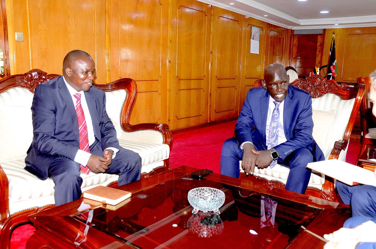 The PS State department for Immigration and Citizen Services Dr.Belio Kipsang pose for aphoto with Steve Rookwood on far left,head of delegation from Family Search who paid him a courtesy call.They discussed about improving digitisation of Civil Registries among other things.