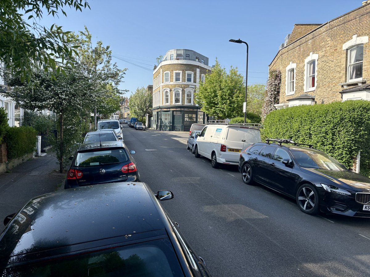 When I post archival photos of local streets showing them without any parked cars, someone often comments that they “used to be so wide.” To illustrate this idea more clearly, I created mock images of present-day views, Winston Road, in this example, where the cars, telephone