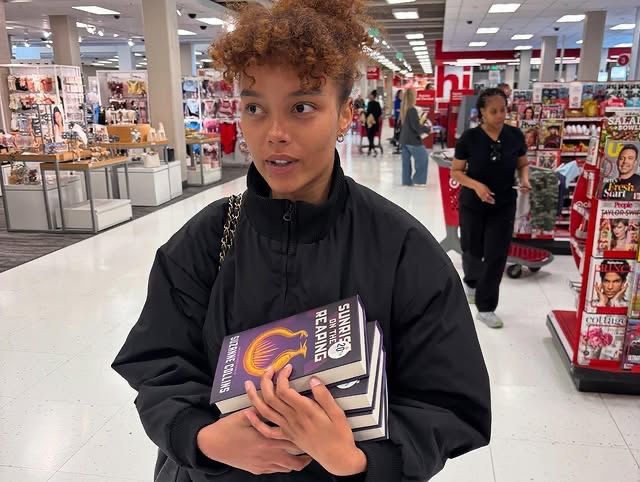 Whitney Peak shared a new photo featuring multiple Sunrise on The Reaping books following the recent announcement that she’ll play Lenore Dove in the film adaptation. 📕