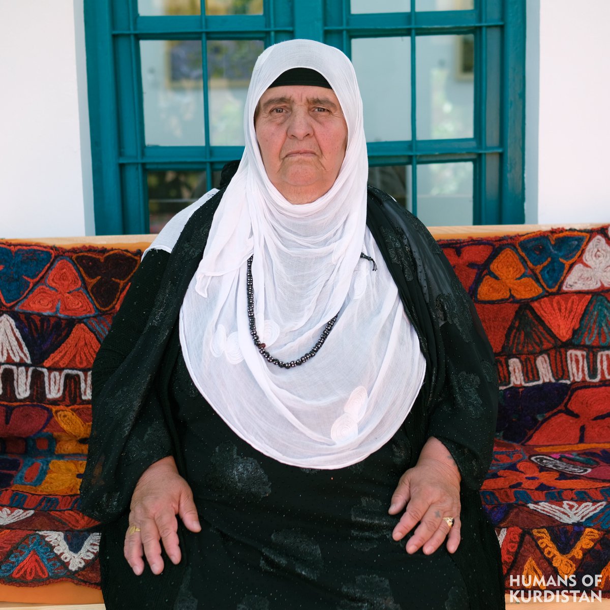humansofkrd's tweet photo. چیرۆکی کوردێکی باشوور 

کاتێک لە زیندانی دوبز بووین، ژنی دووگیانمان لەگەڵدا بوو، ھەر ژنێک منداڵی ببوایە، من مامانیم بۆ دەکرد، لە تافی لاوییەوە، کە تەمەنم ٢٠ ساڵان بوو، لە گوندەکەمان، فێری ناوکبڕین و مامانیی ژنان ببووم.
ناوم (نێرگز عەزیز بابا عەزیز)ە، ناسراوم بە (نێرگزی مامان)، ساڵی (١٩٥٥) لەدایک بووم، خەڵکی گوندی (جەباری)ی سەر بە قەزای (چەمچەماڵ)م.
درەنگانێکی شەو بوو، سەربازانی بەعس دایان بە سەر گوندەکەماندا و ھەموومانیان بە سەیارەی سەربازیی سەرداپۆشراو بەرەو (تۆپزاوا)ی کەرکووک ڕاپێچ کرد. سەرەتا هەموومانیان لە یەکتری جیا کردەوە، ژنەکانیان بۆ زیندانی دوبز برد، پیاوەکانیش بۆ نوگرەسەلمان.
ئەو کاتانەی لە زیندان بووین، ھەموو ڕۆژێک بەرپرسی زیندانەکە دەهات بۆ لامان و پێی دەوتین: ئیتر کورد و کوردایەتی ناکەن، ھەتا دەمرن ئەمە شوێنتانە! لە زیندان و تا ئەو کاتەشی ئازادکراین نەمانزانی ئەوانی تر چییان لێ بەسەرهات، چونکە کاتێک لێکیان جیا کردینەوە، هەندێکیان بەھۆی بەرزیی پلەی گەرما و بێ ئاوییەوە مردن.
لە زیندانەکەی دوبز، زیاتر لە ٦٠ منداڵ بە دەستی من لەدایک بوون. لەوێ گەرچی نەخۆشخانەیەک ھەبوو، بەڵام لەبەر ئەوەی ئێمە کورد بووین، گەر نەخۆشیش بکەوتینایە بۆ نەخۆشخانەکەیان نەدەبردین.
کاتێک سەدام لێخۆشبوونی گشتی دەرکرد و ئازادکراین، هیچمان پیاو و کوڕمان بۆ نەما بووەوە، تەنها لە ماڵی باوکمدا، زیاتر لە ٢٠ پیاو زیندەبەچاڵ کرابوون، خۆم شەش منداڵم ھەبوو. تەنانەت یەکێک لە منداڵەکانم لە نێو زینداندا و لە برساندا گیانی سپارد، خواردن لە زینداندا، تەنها یەک سەموونی ڕەق بوو، منداڵەکەم ھەتا مردیش، هەر هاواری نانی دەکرد.
لە کۆتاییدا، پاش لێبووردنە گشتییەکە، شەوێکیان ئێمەیان خستە ناو (پێنج) سەیارەوە و دواتر لە عەربەت فڕێیان داین، لەو شەوە بە دواوە، تاوەکو دوو ساڵ بەر لە ئێستاش، لە پیشەی مامانی بەردەوام بووم، بەڵام دواتر حکومەت بە فەرمی پیشەی مامانیی قەدەغە کرد.
-
Story of a Kurd from Southern Kurdistan

When we were in Dubz prison, pregnant women were with us. Whenever a woman gave birth, I would act as the midwife. When I was 20 years old, in our village, I had learned how to cut umbilical cords and be a midwife for women.

My name is Nergiz Aziz Baba Aziz, known as "Nergiz the Midwife." I was born in 1955 and am from the village of Jabari in the Chamchamal district.

Late one night, Baath soldiers raided our village and took all of us in covered military vehicles to Topzawa in Kirkuk. At first, they separated us all from each other. They took the women to Dubz prison and the men to Nugra Salman.

During our time in prison, every day the prison official would come to us and say: "You will no longer be Kurdish or practice Kurdish nationalism. This will be your place until you die!" While in prison and until we were released, we didn't know what happened to the others, because when they separated us, some died from the extreme heat and lack of water.

In Dubz prison, more than 60 children were born by my hands. Although there was a hospital there, because we were Kurdish, they wouldn't take us to the hospital even if we fell ill. 

When Saddam issued a general amnesty and we were released, none of our men and boys had returned. In my father's house alone, more than 20 men had been buried alive. I had six children. One of my children even died in prison from starvation. Food in prison was only one piece of hard bread. Until my child died, they kept crying out for bread.

Finally, after the general amnesty, one night they put us in five vehicles and later dumped us in Arbat. From that night until two years ago, I continued in the profession of midwifery, but later the government officially banned the practice of midwifery.
-
قصة كردية من جنوب كردستان

عندما كنا في سجن دوبز، كان معنا نساء حوامل. كلما ولدت امرأة، كنت قابلتهامنذ زمن الشباب عندما كنت في قريتنا تعلمت آلية قطع السرة.
اسمي (نركز عزيز بابا عزيز)، وأنا معروفة باسم القابلة نركز. ولدت في عام 1955 في قرية (جباري) في قضاء جمجمال.
كان الوقت متأخراً في الليل عندما داهم جنود البعث قريتنا وسحبونا جميعاً في مركبات عسكرية مغطاة إلى (توبزاوة) في كركوك. أولاً قاموا بفصلنا جميعاً، وأخذوا النساء إلى سجن (دوبز) والرجال إلى سجن( نوكره سلمان). 
عندما كنا في السجن، كان مدير السجن يأتي إلينا كل يوم ويقول لنا: لن تقوموا بأنشطتكم كأكراد  بعد الآن. هذا هو مكانكم حتى تموتون! وحتى خروجنا لم نعرف ماذا حدث للآخرين، لأنه عندما فصلونا مات بعضهم بسبب ارتفاع درجة الحرارة ونقص الماء.
في سجن دوبز، ولد أكثر من 60 طفلاً على يدي. رغم وجود مستشفى هناك، لكن لأننا أكراد، لم يأخذوننا إلى المستشفى إذا مرضنا. 
وعندما أصدر صدام عفواً عاماً وأُطلق سراحنا، لم يبق لنا رجال ولا أبناء. لقد تم دفن أكثر من 20 رجلاً أحياءً من الرجال الموجودين في منزل والدي. كان عندي ستة أطفال. حتى أن أحد أبنائي مات من الجوع في السجن. كان الطعام الوحيد في السجن هو خبز واحد صلب. لقد بكى طفلي من أجل الخبز حتى مات.
وأخيراً، بعد العفو، في إحدى الليالي وضعونا في ( خمس) سيارات ثم ألقوا بنا في عربت. ومنذ تلك الليلة، واصلت العمل كقابلة حتى قبل عامين، ولكن بعد ذلك حظرت الحكومة المهنة رسمياً.

#Chamchamal | #Vim_Foundation
https://t.co/QsOe6T5lKy