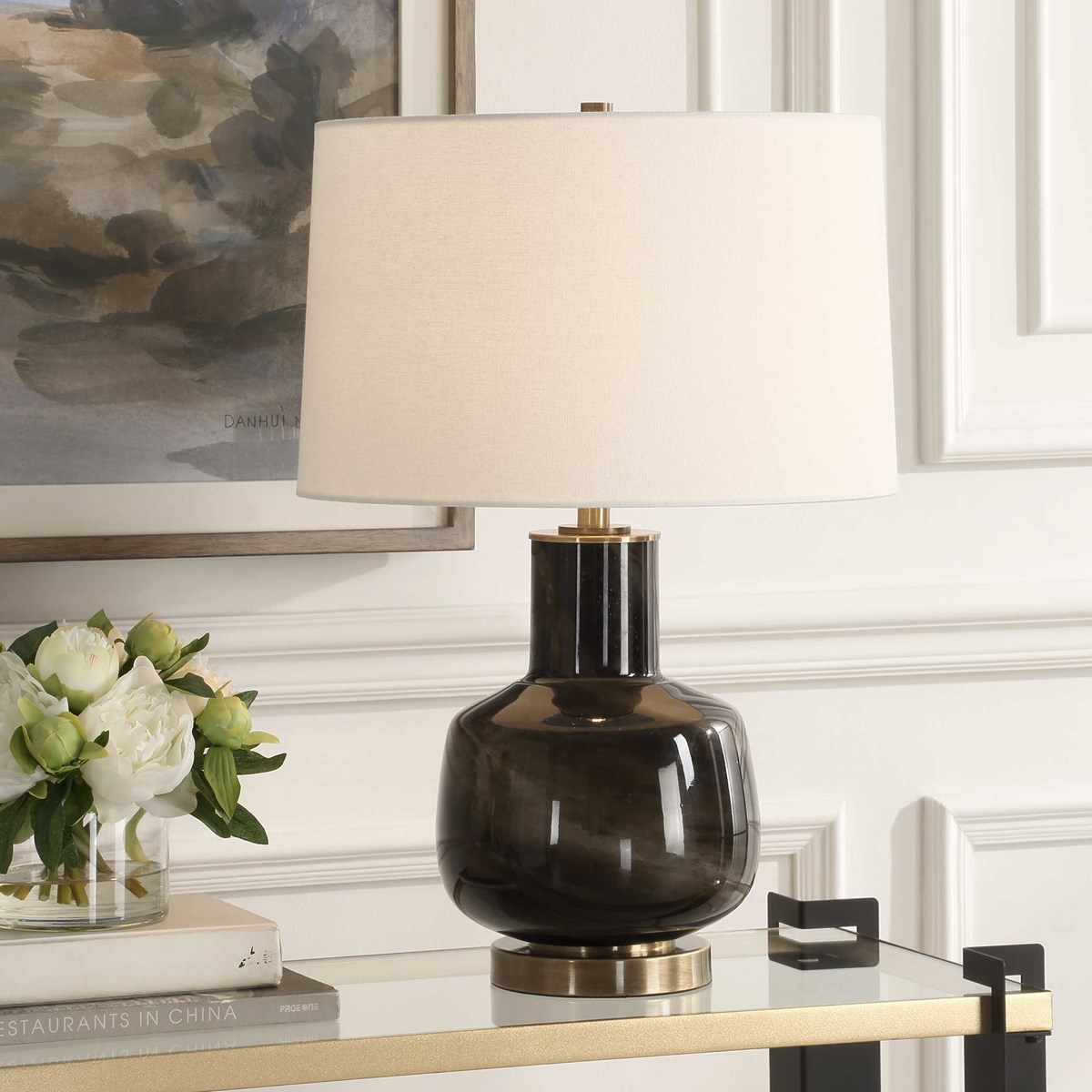Last chance to visit the #uttermost showroom today <a href="/HPMarketNews/">High Point Market</a> - Our new Buchanan Table Lamp showcases a smokey charcoal glass, accented with plated brass details that conveys a sense of opulence. uttermost.com/buchanan-table… #carolynkinder #hpmkt #interiordesign