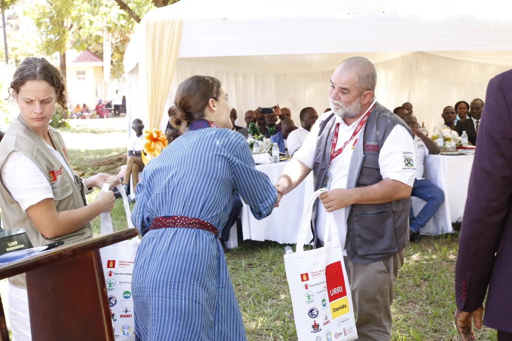 PICOT-WESTNILE UG (@picotug) on Twitter photo After the official <a href="/URRI_Danida/">Uganda Refugee Resilience Initiative (URRI)</a> launch in Yumbe, guests received URRI branded gifts from Anne Sofie Oxlund, representing the Danish Ambassador <a href="/DKAmbUganda/">Signe Winding Albjerg</a> thanking all who champion refugee & host community resilience & climate-smart solutions.
<a href="/DKinUganda/">Denmark in Uganda</a> <a href="/drcEA_GL/">DRC East Africa & Great Lakes</a> <a href="/DCAUganda/">DanChurchAid Uganda</a> After the official <a href="/URRI_Danida/">Uganda Refugee Resilience Initiative (URRI)</a> launch in Yumbe, guests received URRI branded gifts from Anne Sofie Oxlund, representing the Danish Ambassador <a href="/DKAmbUganda/">Signe Winding Albjerg</a> thanking all who champion refugee & host community resilience & climate-smart solutions.
<a href="/DKinUganda/">Denmark in Uganda</a> <a href="/drcEA_GL/">DRC East Africa & Great Lakes</a> <a href="/DCAUganda/">DanChurchAid Uganda</a>