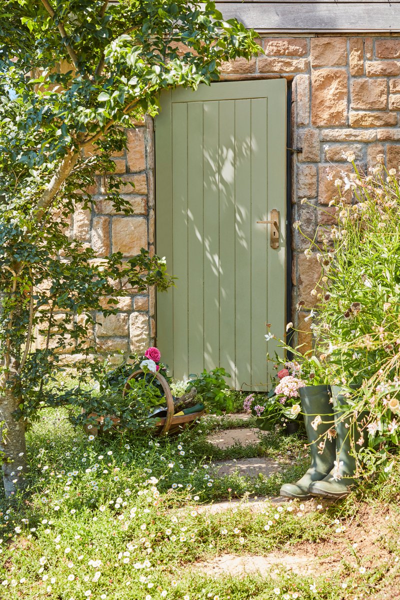 Painting exterior doors is a great way to create a focal point in your outside space. A neutral green such as Boringdon Green adds sophistication when used alongside red brick.