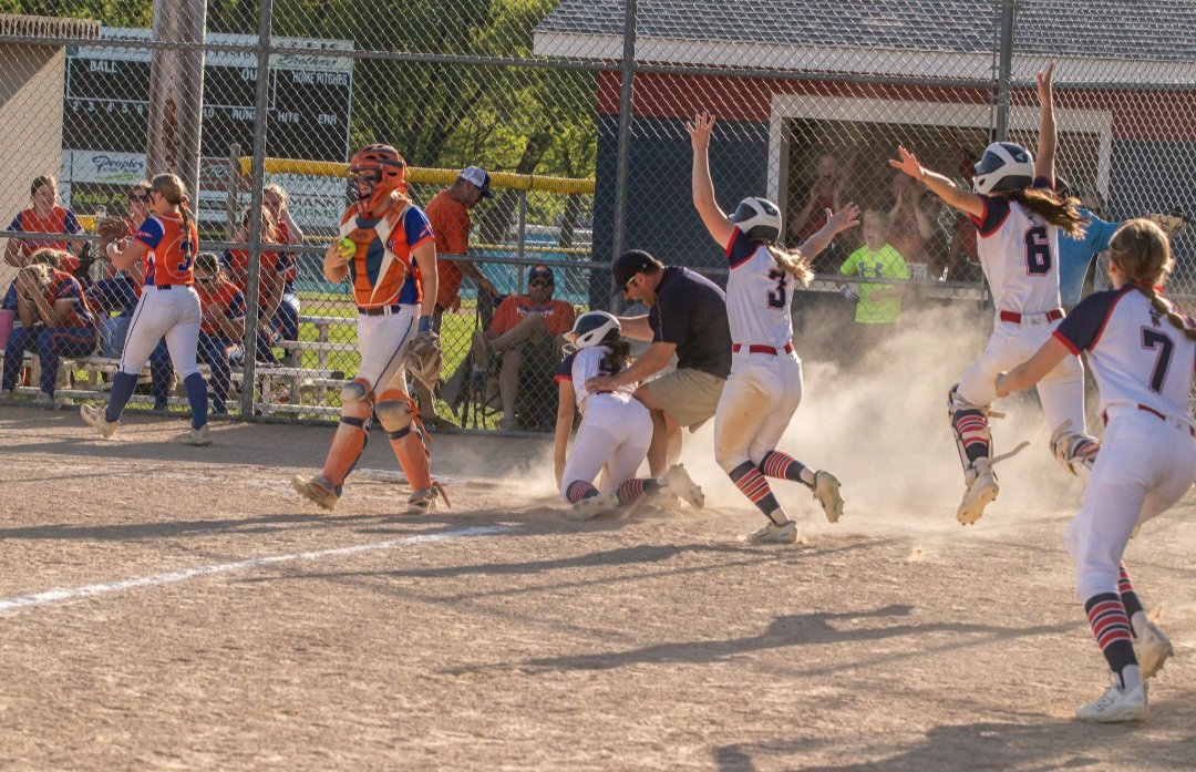 Here's the start of the United South Central softball celebration after the Rebels defeated Randolph 1-0 in 9 innings Monday. USC is ranked first in Class A, Randolph same in 2A. Both came in unbeaten. Photo by Izzy O’Rourke, Rocking Z Photography.