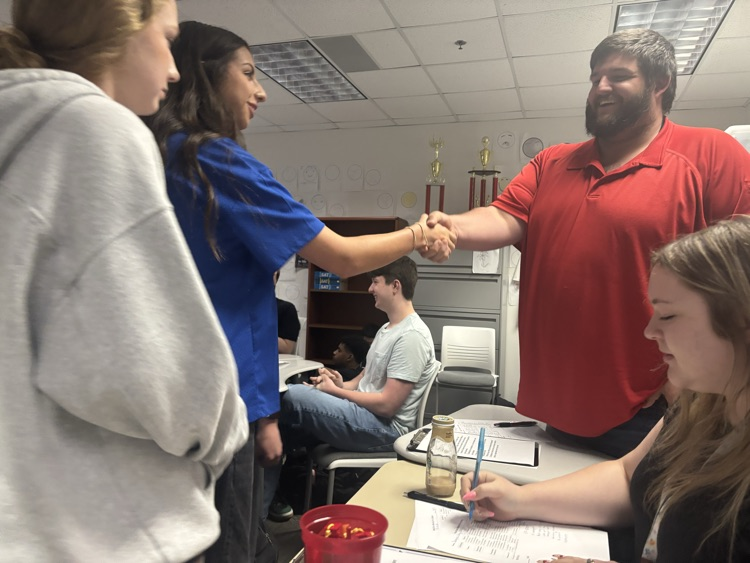 Our very own Coach Indelicato (aka Mr. Wonderful) turned his classroom into Shark Tank 🦈  Students created companies and pitched their ideas to "the Sharks," while they confidently defended their business plans! Way to invest in your students' learning, Coach! #PhoenixOn