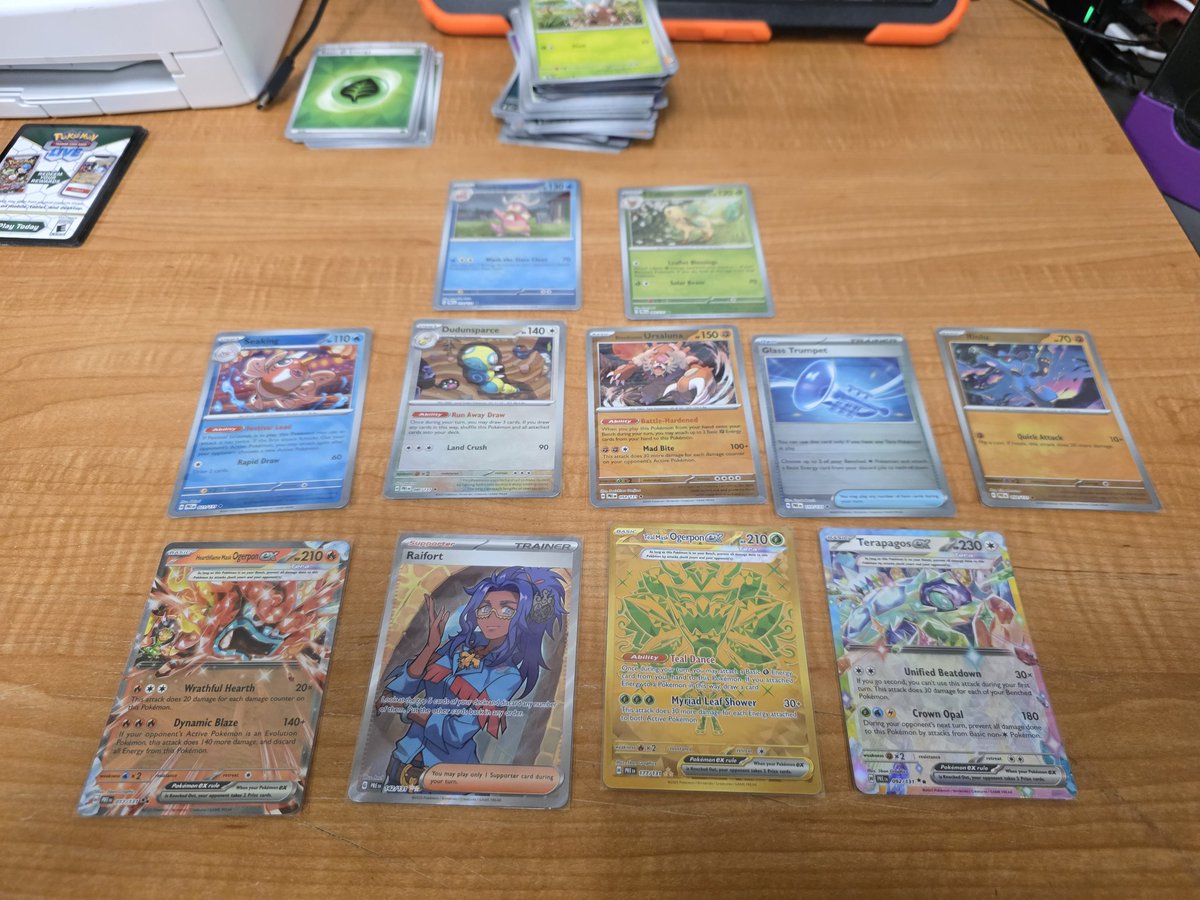 talonegress's tweet photo. Prismatic Evolutions booster bundle order from pokemin center came in today. This is what 12 packs got me. Top is master balls, middle is poke balls. https://t.co/o38k9GdtJg