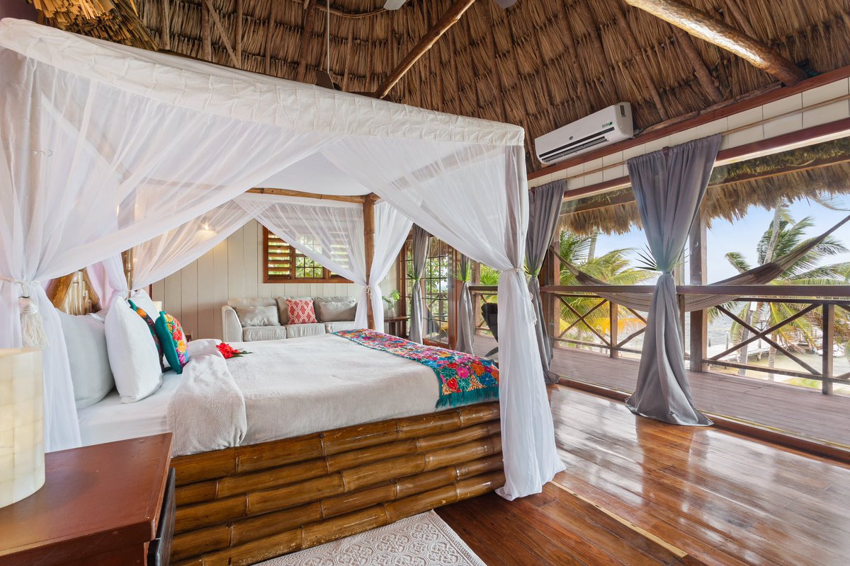 Honeymoon suite at Portofino Beach Resort Belize. The entire front is made of windows, overlooking the coral reef. #portofinobelize #vacation #belize 🇧🇿