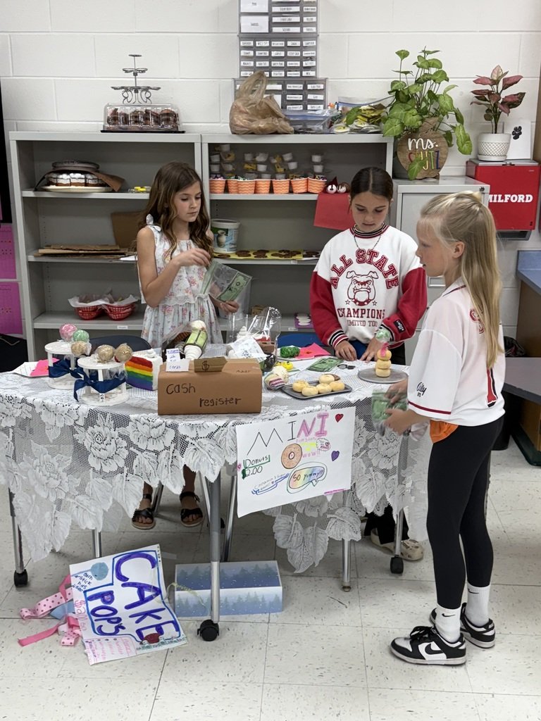 Decimals + Dough = Sweet Success!

Yesterday, Cayla Stutz’s class at Meadowview hosted a mock bake sale! Students crafted pretend desserts, used a $50 budget with real prices, and practiced money skills—like calculating profit + making change. Real-world math never looked so fun!