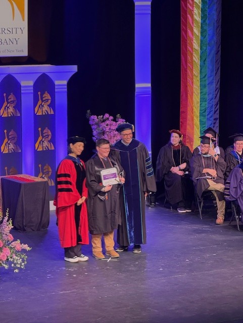 UAlbanyEdu's tweet photo. Congratulations to our friend and colleague, Melissa Starman, Department Coordinator, Educational &amp; Counseling Psychology, on receiving the OUT-Standing Faculty/Staff Leadership Award at today's Lavender Celebration! #UAlbanyGrad https://t.co/SQtPnels5I