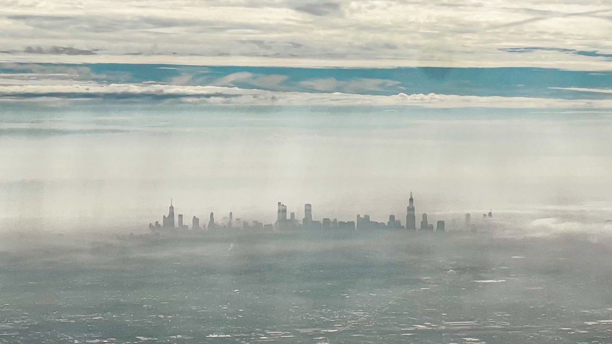 Chicago with some morning fog as seen from a <a href="/united/">United Airlines</a> flight departing <a href="/fly2ohare/">O'Hare Intl. Airport</a> earlier today