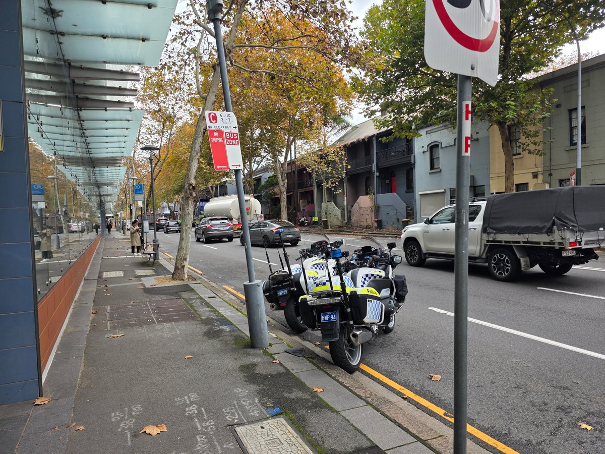 ruggo's tweet photo. I have great respect for the police, but there's great irony in two @nswpolice HWP officers parking their bikes in a Bus Zone AND a No Stopping zone so they can stand around the corner hoping to bust motorists for traffic offences. Regular occurrence. https://t.co/UshliYbTAK