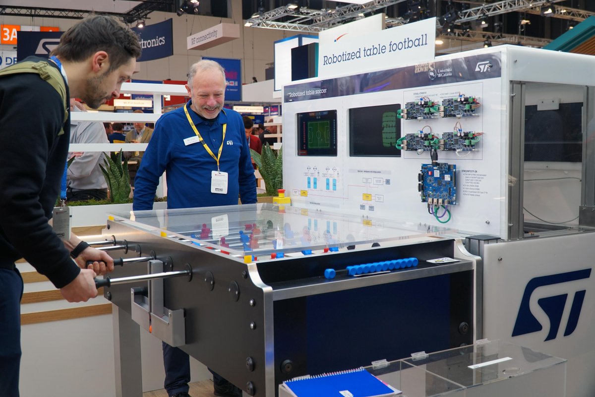 ST_World's tweet image. How to play table football against a robot?⚽At #EW25 we displayed a robotized football, powered by #EdgeAI. The system integrates mechanical, electronic and software components all coordinated by a vision system that tracks the ball.🔍More on the #STBlog: spkl.io/6012fL9KQ