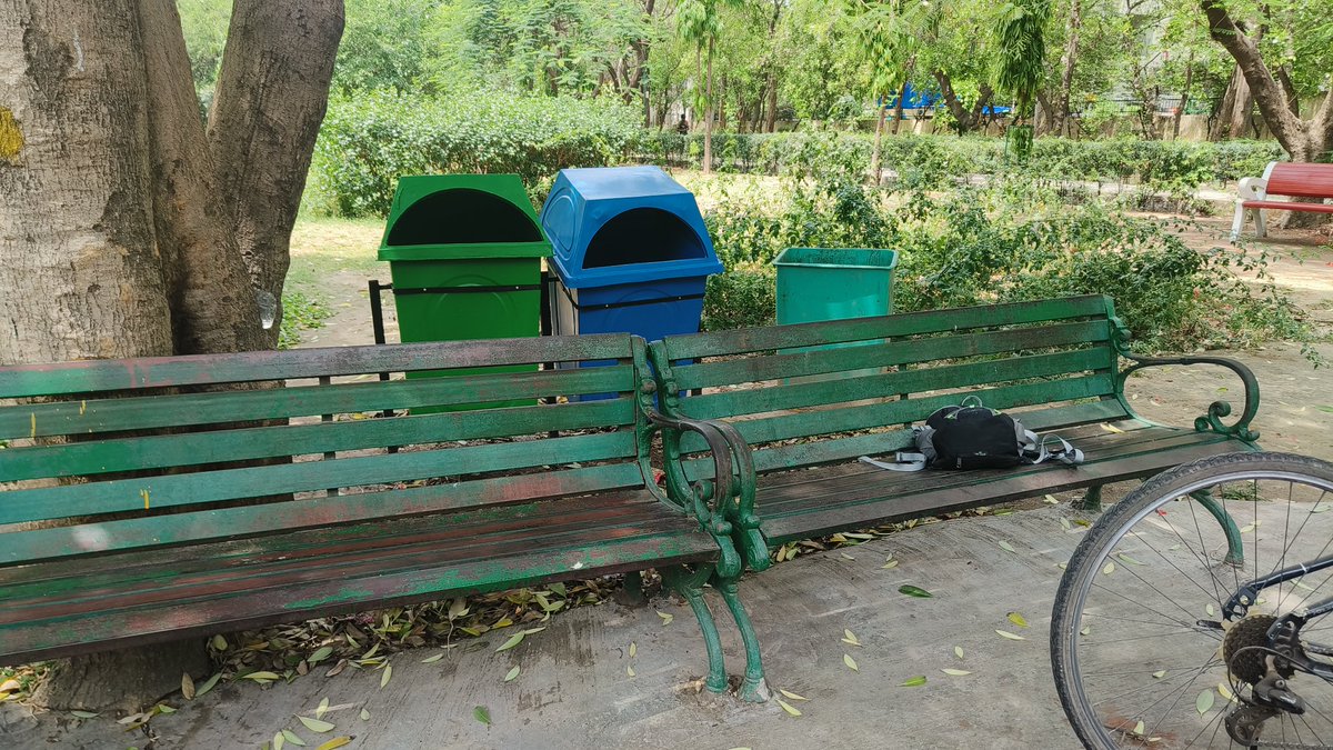 Shammijee's tweet photo. @official_dda whose idea is this to place dustbin just two feet away from sitting bench !  Do u want people to relax in the smell of your dustbins.  Couldn't they have been placed atleast 15 - 20 feet away from the bench?  This is Distt park  in front of Cambridge foundation skol https://t.co/QOtJRDT6HP
