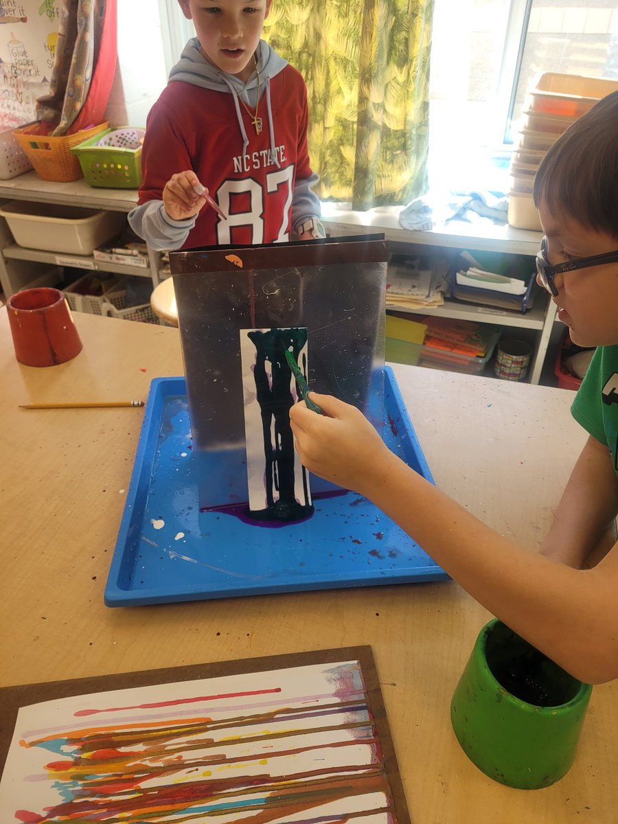 Ms. Finne's class learned about abstract expressionist and color field painter Morris Lewis and used diluted paints and the force of gravity to create drip art.