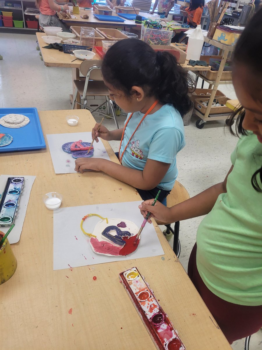 2nd graders in Ms. Park's class paining their ceramic wall hangings.