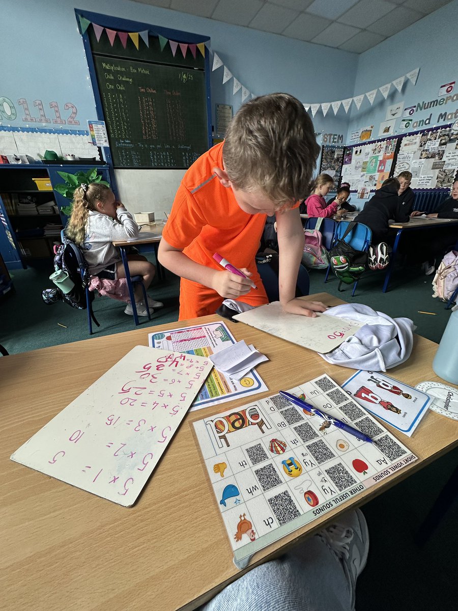 MissMcLay's tweet photo. We were working hard in numeracy! Some tackled a chilli challenge using the box method with up to 1 x 4-digit numbers, while others focused on their 5 times table. Our in-class experts even stepped up to support their classmates—amazing teamwork! #ChilliChallenge #PeerSupport https://t.co/dbFkDX37zV