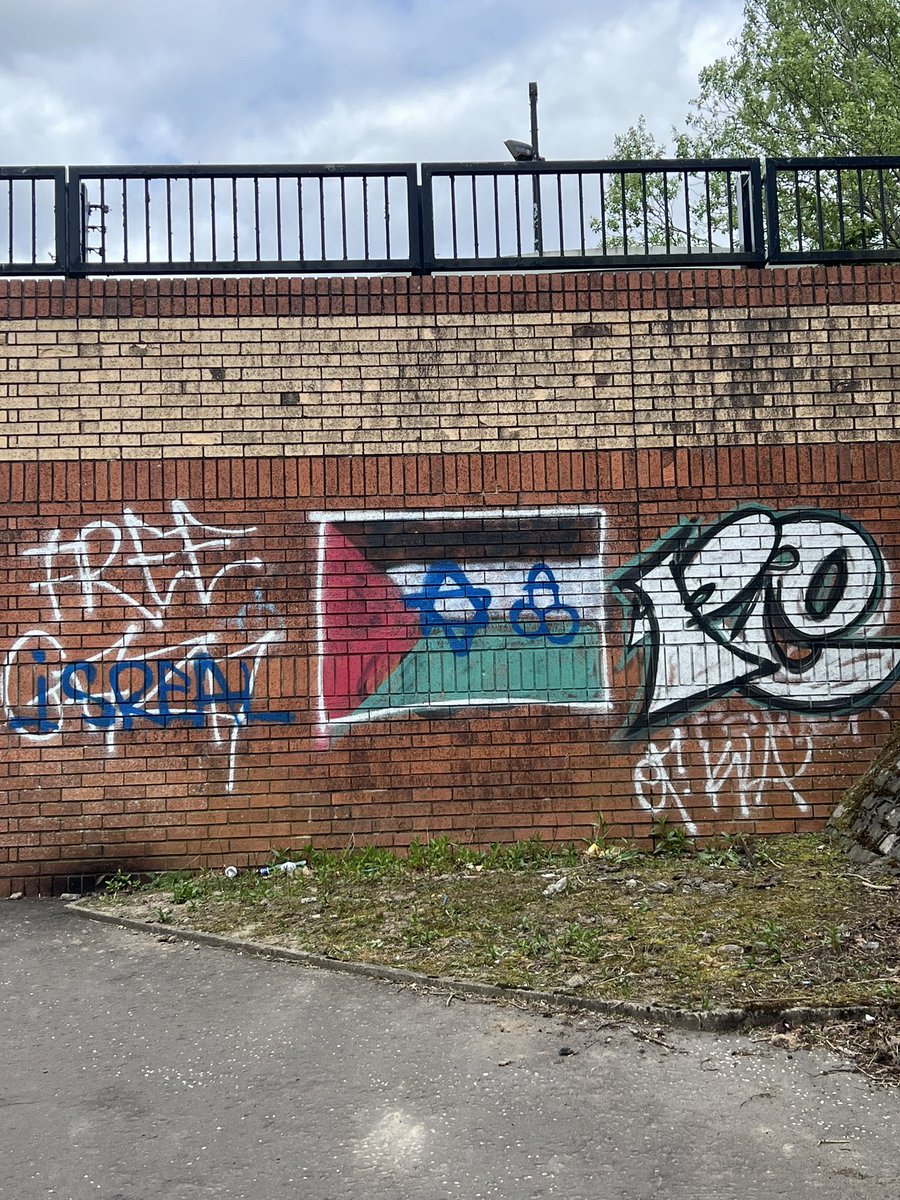 the Palestinian flag was there few weeks ago, then the Israeli star and the F sign were put on top it . No matter which party they support, it’s not right put graffiti on public buildings or private properties, whoever did these only push silent majority away. Pathetic !