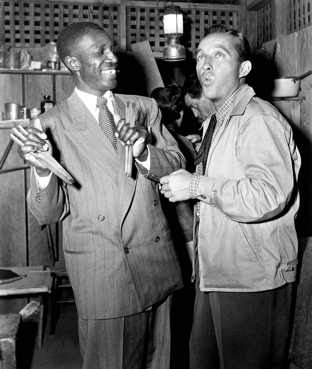 Clarence Muse and Bing Crosby during a break from filming Riding High (1950)