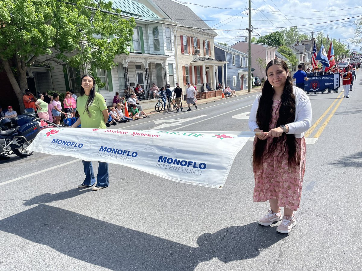 Interact Members helped carry banners in the Apple Blossom Parade 🌸