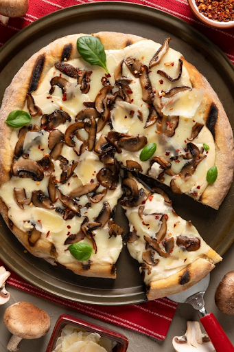🍕 Who doesn’t love pizza night!? Make it extra fun-gi with this Three Mushroom and Garlic Grilled Pizza recipe 👉 bit.ly/4iFgpoQ #PizzaRecipe #KidsEatMushrooms2 #ChildNutrition