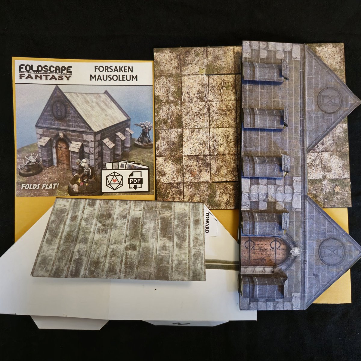 The latest from the @Foldscapes Terrain patreon: A fold-flat mausoleum. This one has a cool inset roof and interior walls. Of course I added a floor tile and props.

patreon.com/posts/12806845…

#wargaming
#papercraft 
#terrain
#popup
#foldflat
#dungeonsanddragons
#tabletopterrain