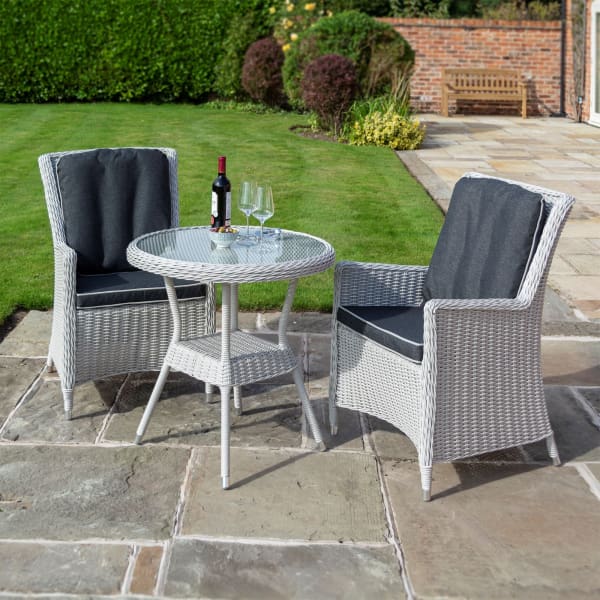 The Garden Lover Bistro Set is perfect for an outdoor or conservatory setting. This attractive all weather rattan effect bistro set  has back and seat cushions &amp; includes two chairs &amp; a glass topped table. Half round wicker &amp; powder coated aluminium frames. Delivery 7 days.£495