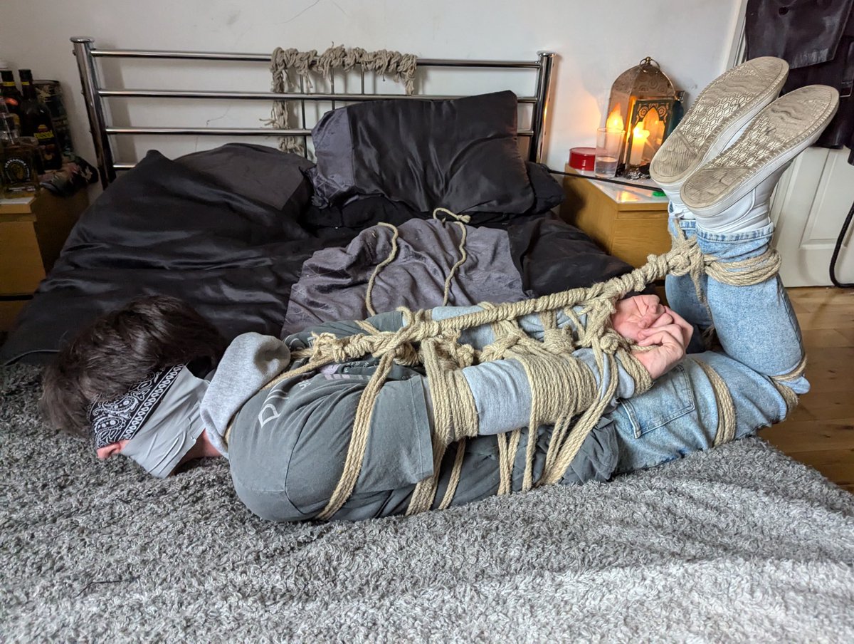 This sk8r boy was snatched off the street, bundled into a white van, gagged before he could shout, and bound tight with rope. Now he lies there, helpless—just where they want him… (From a previous meeting with the devious <a href="/Phantom_Bondage/">Phantom</a> 😈)