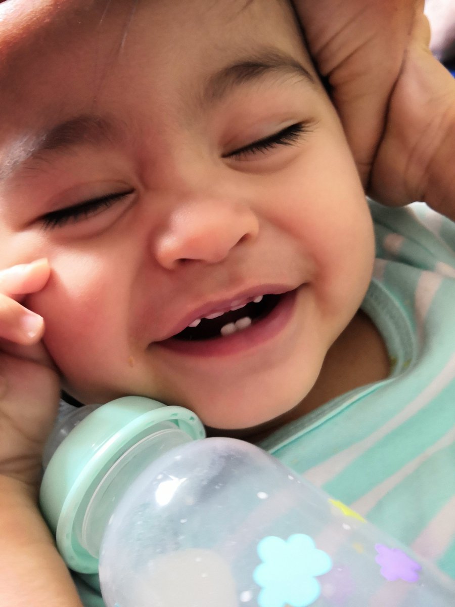 This boy got his front teeth now. He bites everything. Loves his crunchy puffs and fruit.