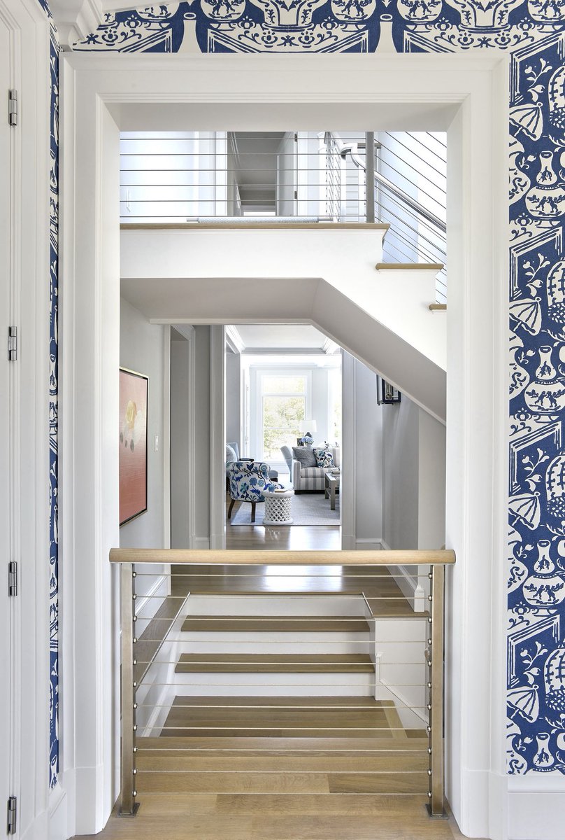 Here are looks at our Smith Cove renovation. Highlights include a spacious new entry hall &amp; three-story staircase - where the contemporary cable railing &amp; floating stair landing lighten and modernize the surrounding vocabulary of more traditional wood mouldings. #HomeDesign