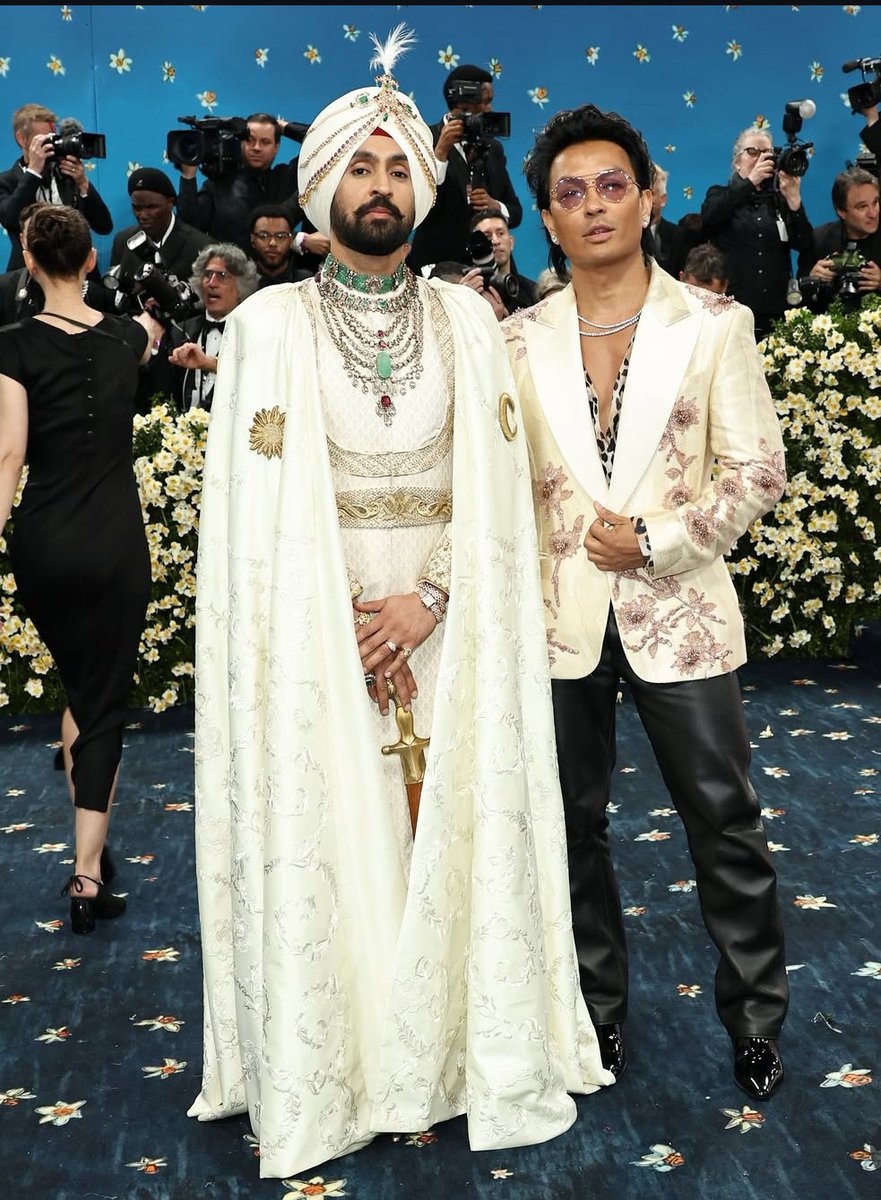 filmfare's tweet image. The art and the artist! 🤍

#DiljitDosanjh poses with #PrabalGurung at the MET Gala 2025

#Trending