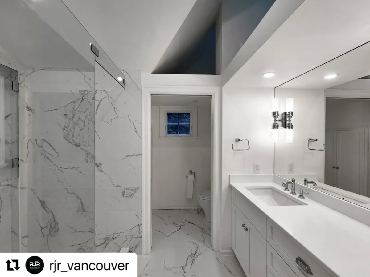 Effortlessly elegant 🤍 Verona in Carrara White brings marble-inspired beauty to this stunning bathroom and shower with its sleek, polished porcelain finish. A timeless look that elevates any space. Design: <a href="/rjr_vancouver/">Richard Robinson</a> #MarbleLook #SophisticatedSpaces #TileDesign