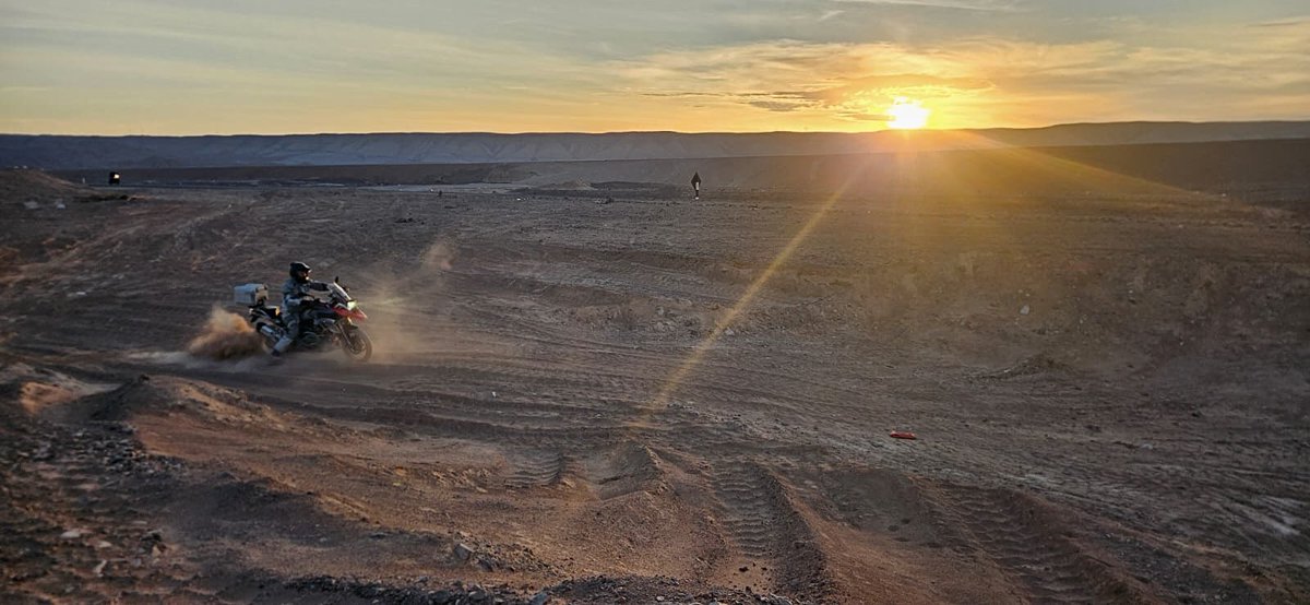 Riding in the desert at sunset