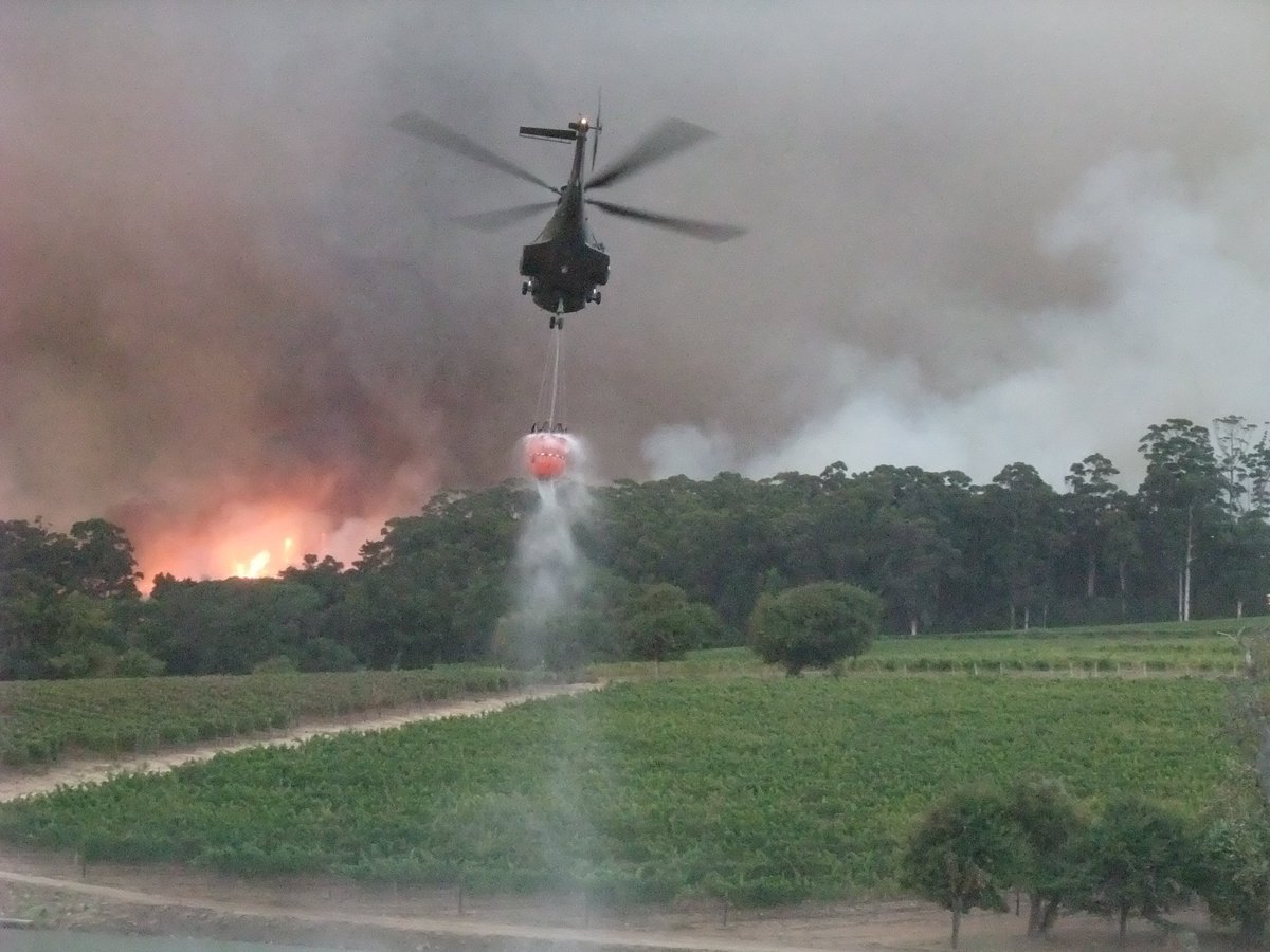 Table Mountain burning!
The recent fires experienced in Tokai, Cape Town reminded me of 2015 when I took this photo of a SAAF Oryx lifting off with a full “bambi bucket” after filling it from a <a href="/KleinConstantia/">Klein Constantia</a> farm dam.
Photograph by Raymond Travers