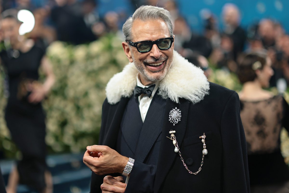 Dheepanratnam's tweet photo. Jeff Goldblum bringing his signature style to the #MetGala2025! ✨ Looking incredibly dapper in a #WalesBonner suit, complete with a fur-collared overcoat and ornate brooches. Effortlessly cool as always! 😎
#JeffGoldblum #MetGala #WalesBonner #MetGalaStyle #Fashion https://t.co/BlbG3271jP