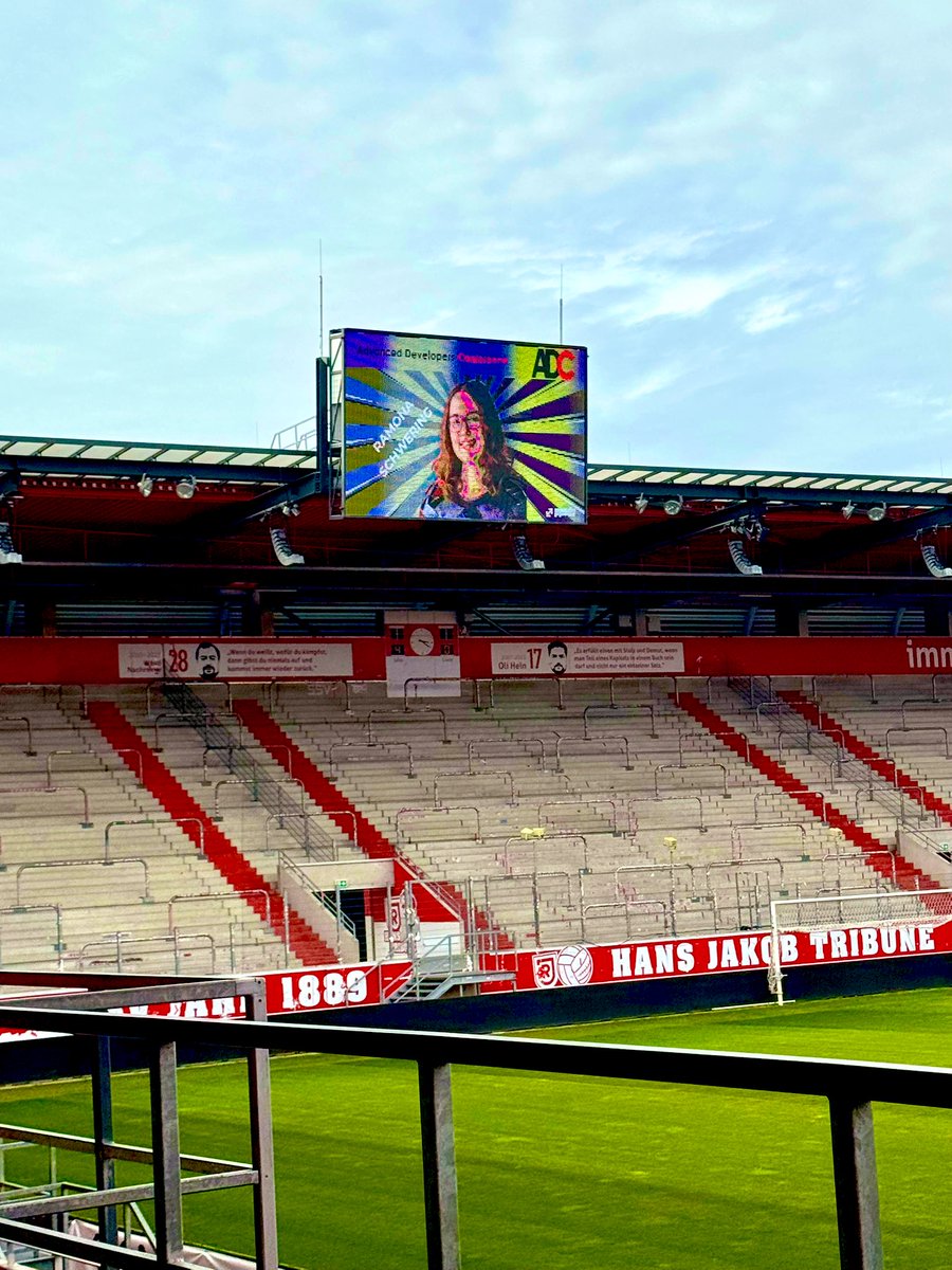leichteckig's tweet photo. How cute is this! 😍 I never thought to see my face in superhero attire on a Stadium screen. 🦹♀️ Maybe that’s a good omen to save our code from Skynet? Please join me tomorrow in my session at 9:00am in room 1 to find out. #adc25 https://t.co/Hdq4pLm9S4