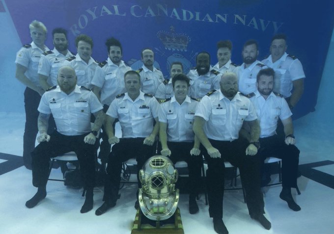 The Canadian Naval Diving Academy celebrates graduation by taking their class picture underwater